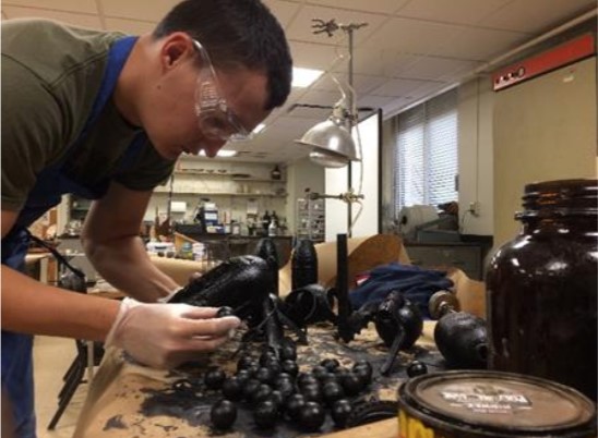 Josh Farrar working in the conservation lab