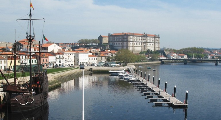 View of Vila do Conde showing the replica of a 16th century ship on the waterfront.